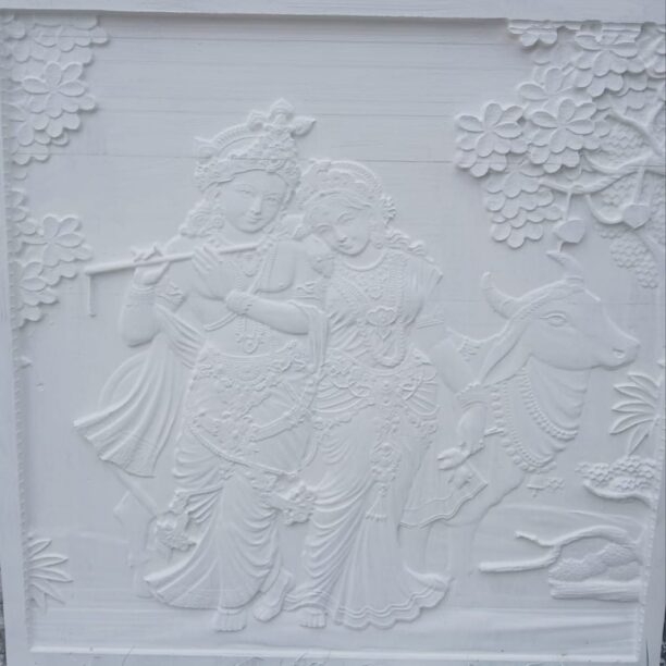 white stone wall mural of a divine couple